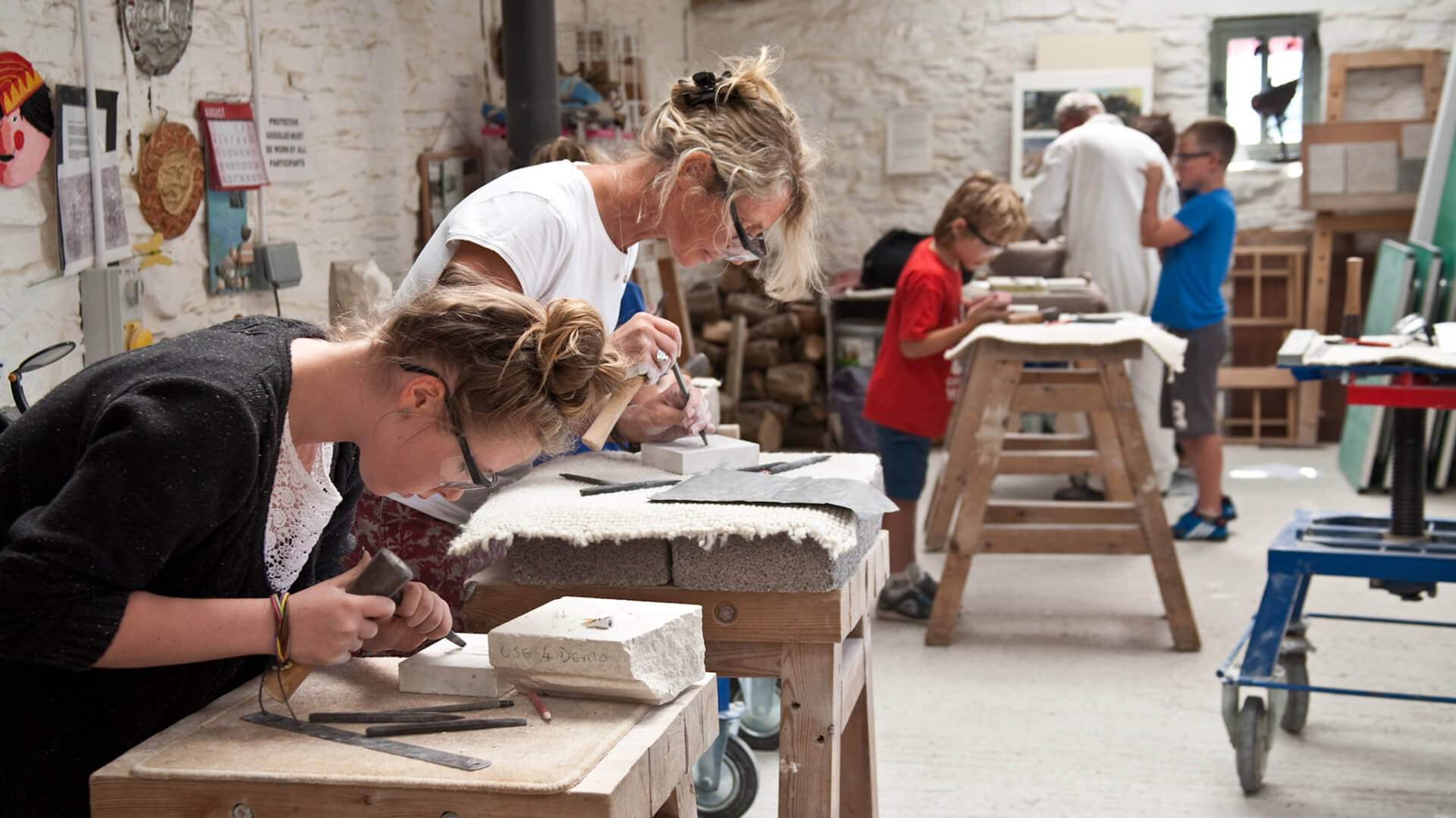Groups of people taking a class at Burngate Stone Carving Centre