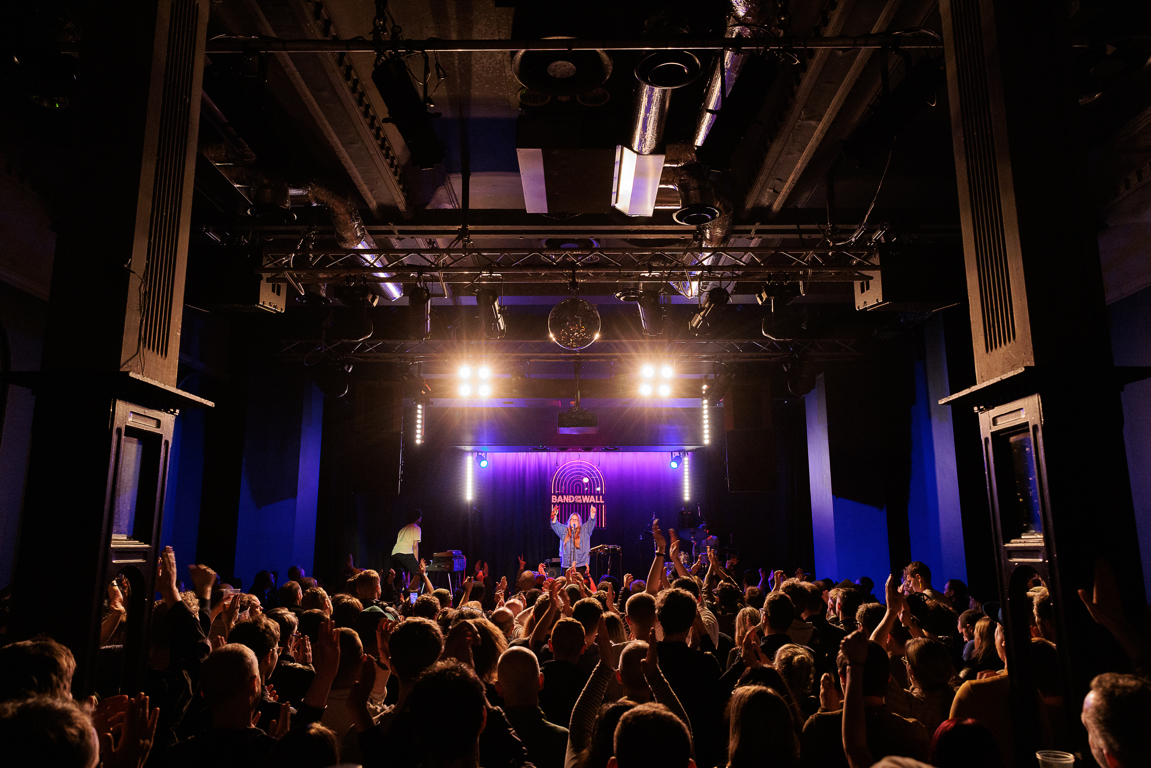 A live performance on stage at Band on the Wall in Manchester