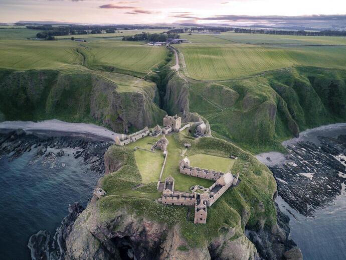Castle on a rocky outcrop surrounded by sea