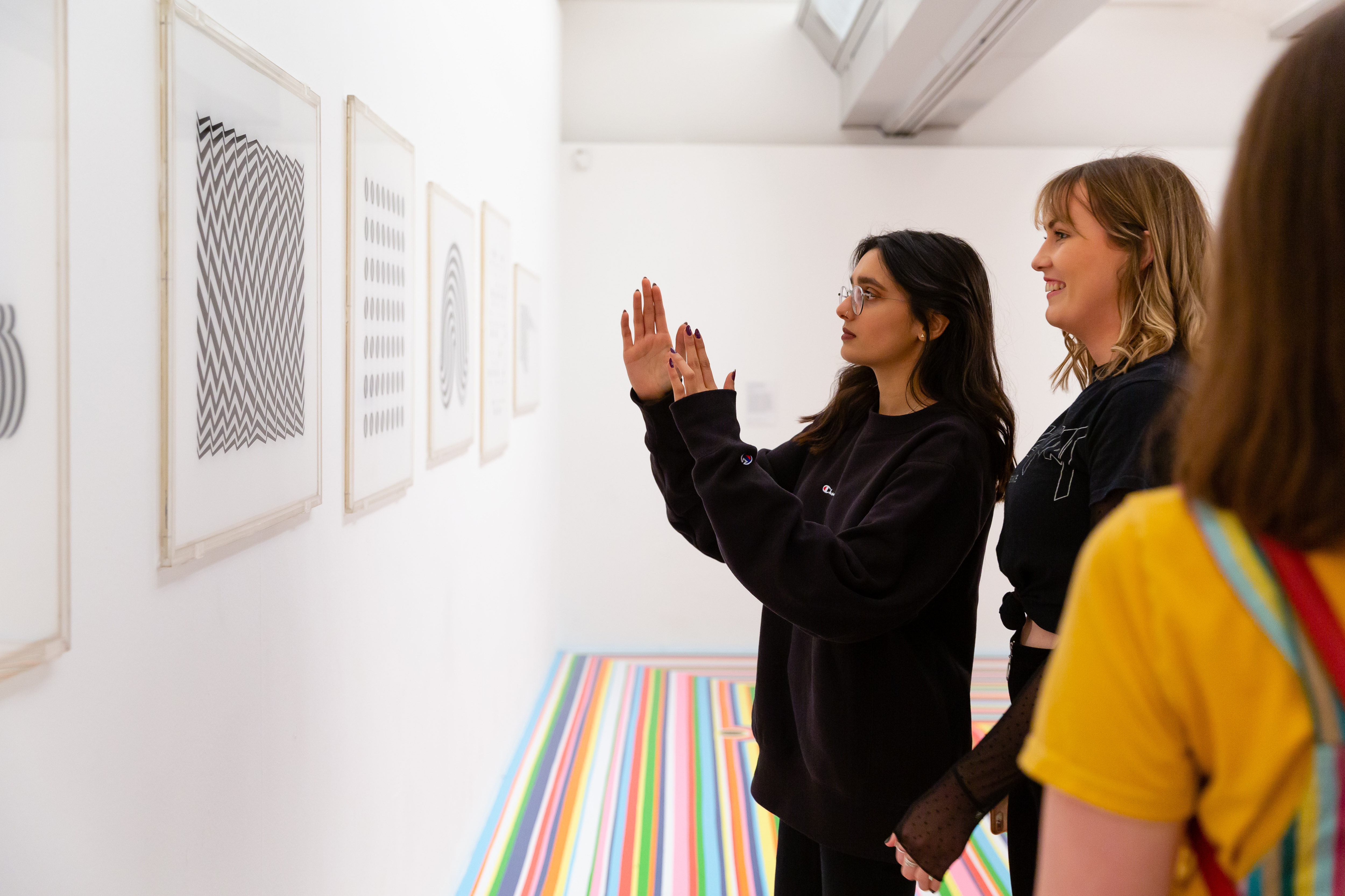 Young people discussing Bridget Riley at the Tate Liverpool