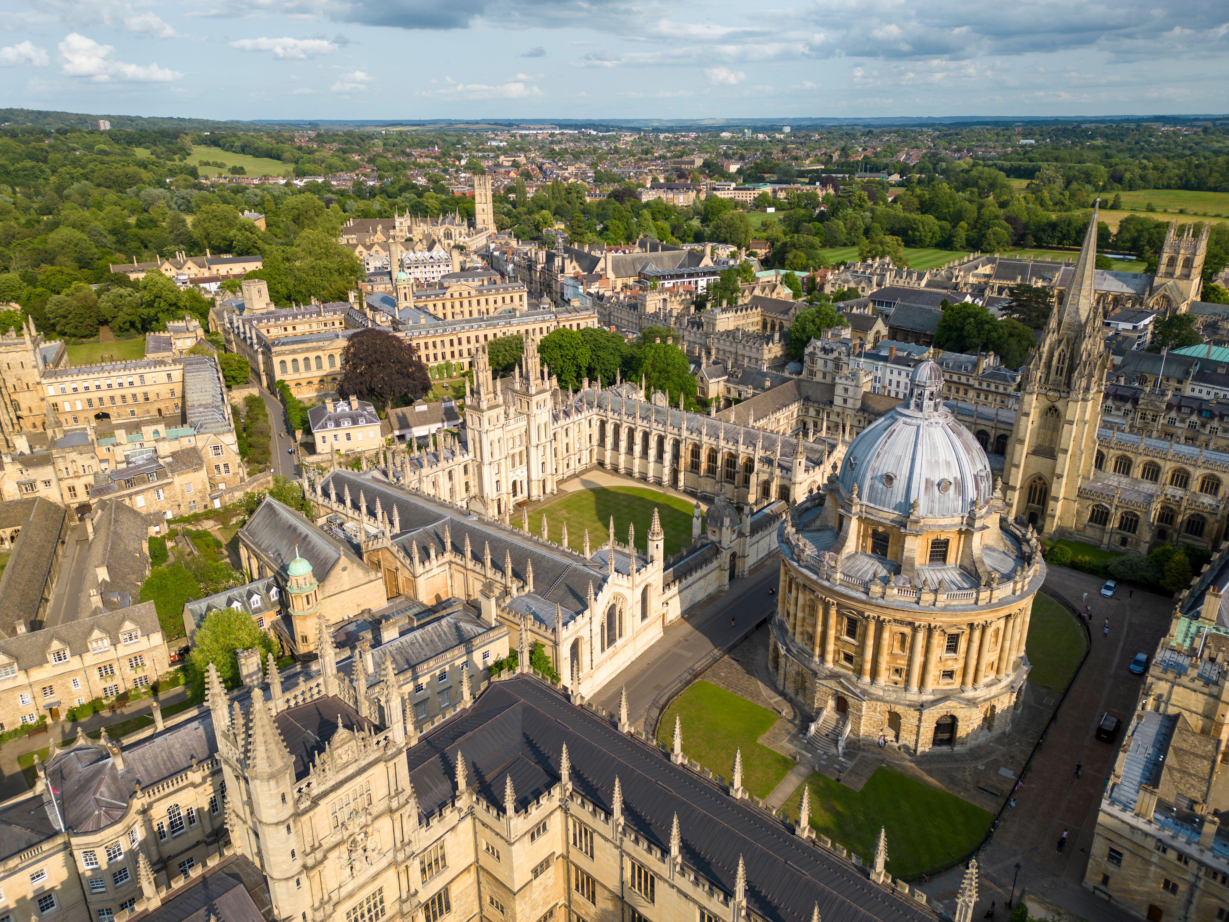 Aerial view of university featuring large dome and historic stone buildings