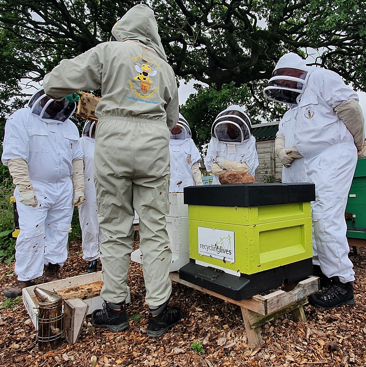 A group of people wearing Beekeeper costumes at The Bee Centre