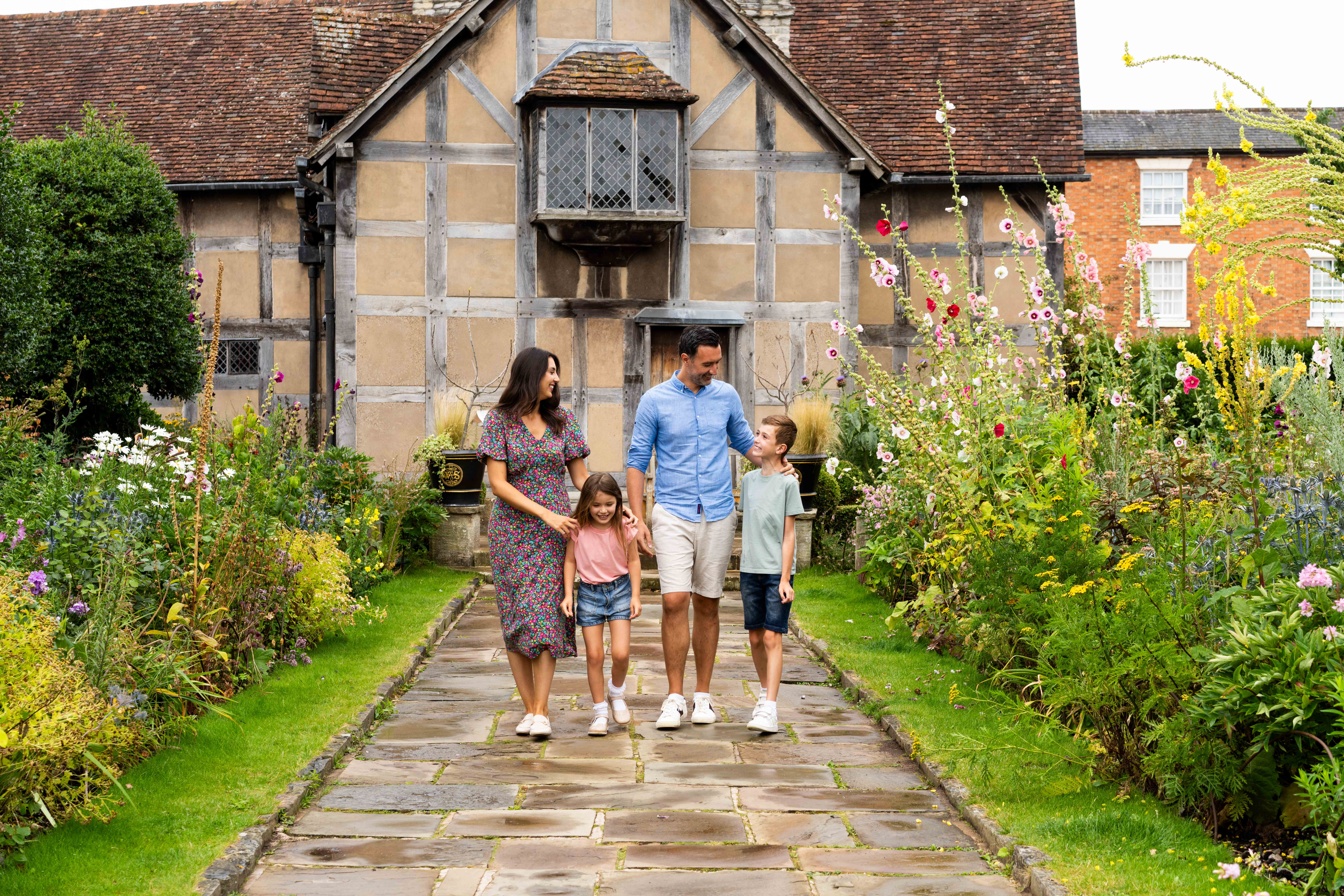 A family walking together outside heritage building