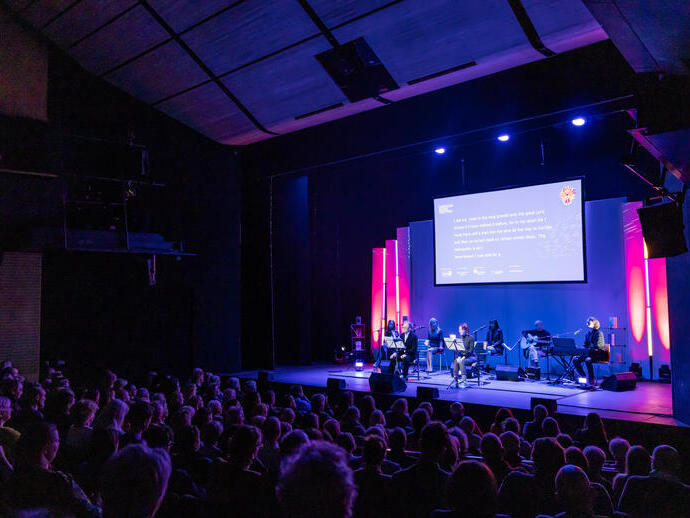 People watching a performance in a theatre
