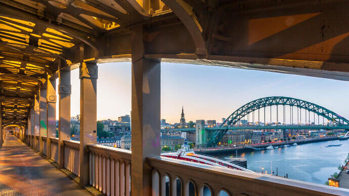 View from pedestrian level of the two bridges connecting Newcastle and Gateshead during a summer evening in June.