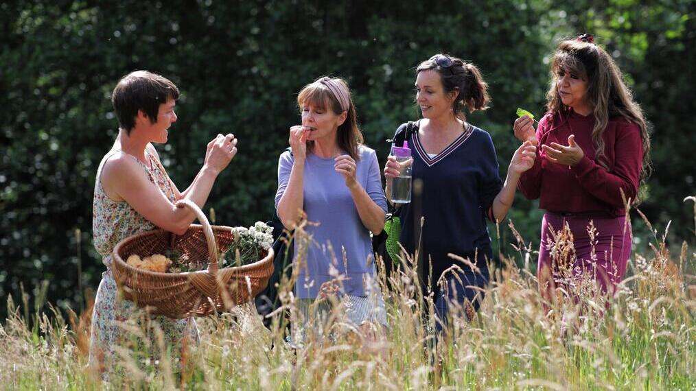 A group of people talking - Northern Wilds