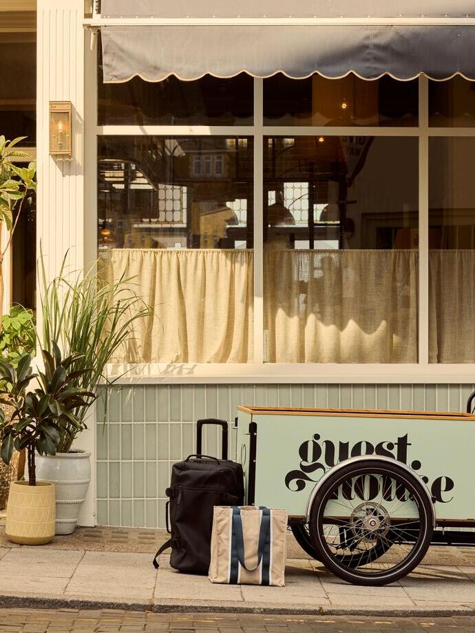 A luggage bike outside a luxury boutique seaside hotel.