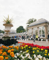 Groups of people exploring the art installations in Sheffield Botanical Gardens