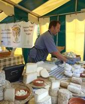 A man selling cheese at St Dogmaels Local Producers Market