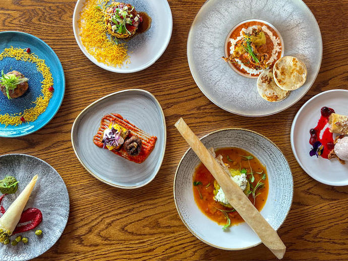 Various dishes served on a table at Prashad Restaurant in Leeds