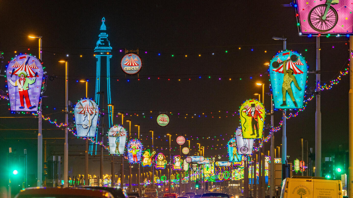 Blackpool Illuminations lighting up a road at night.