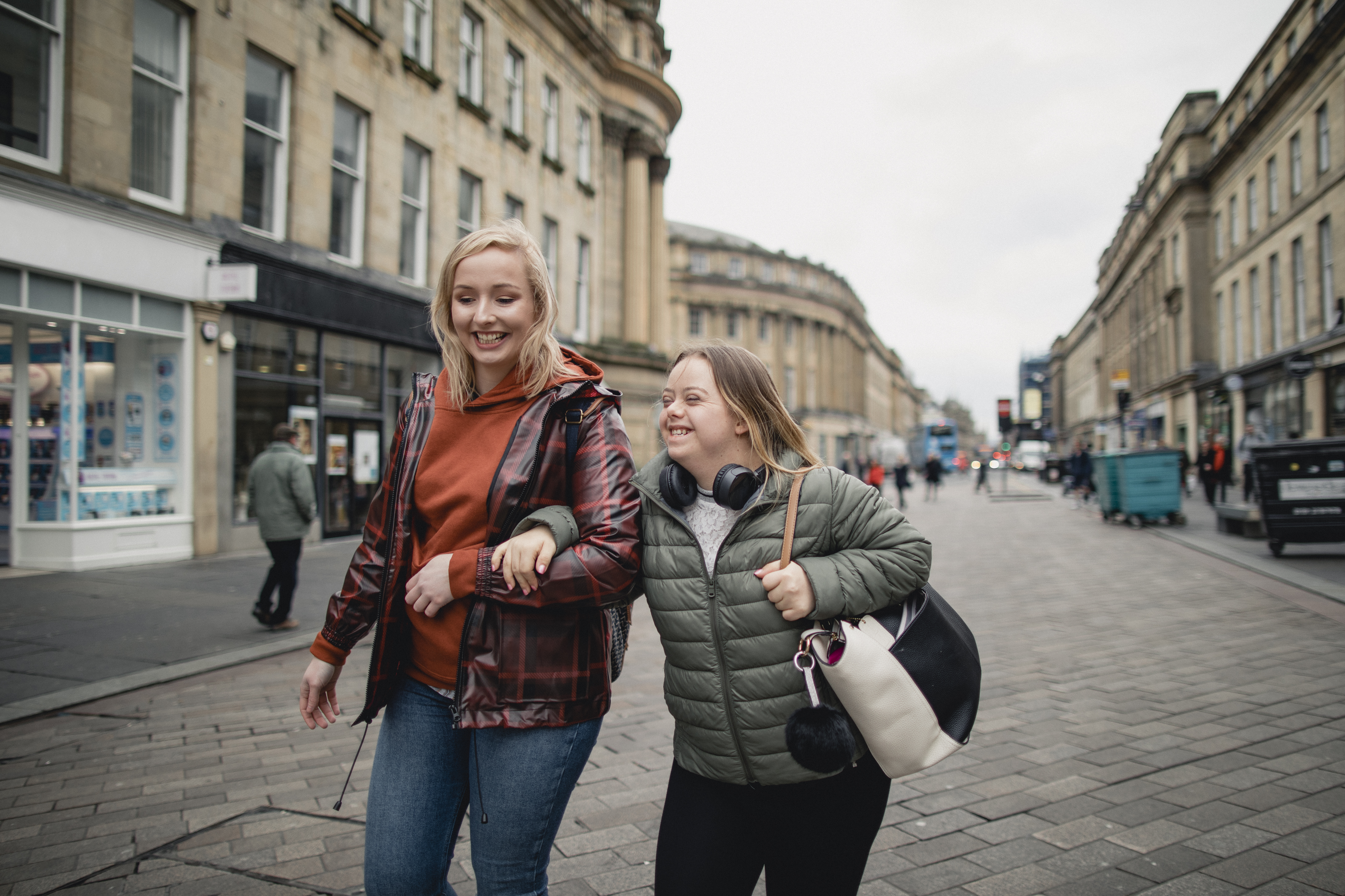 Young female with Down's Syndrome bonding with her friend