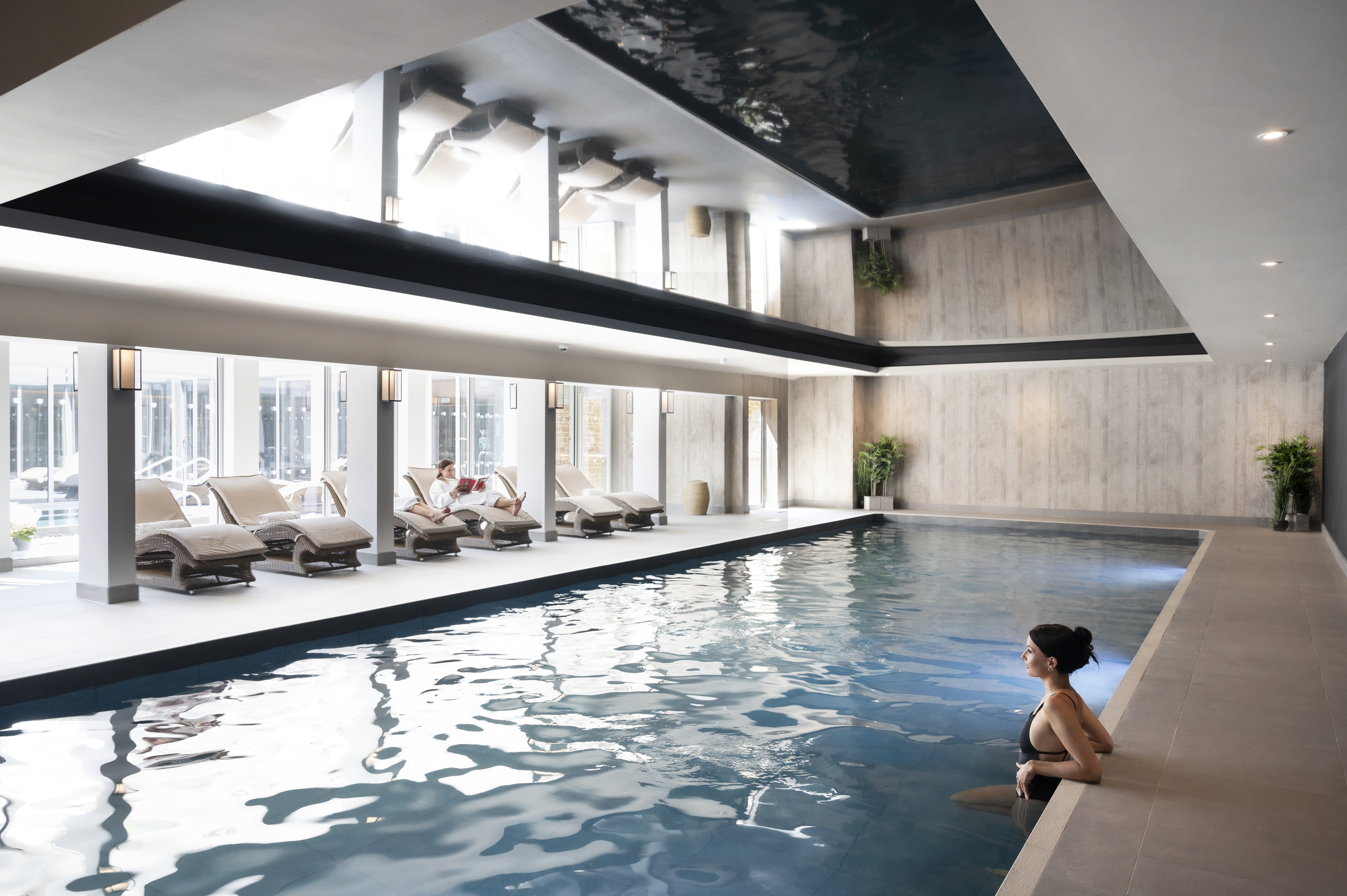 A woman relaxing inside a spa area.