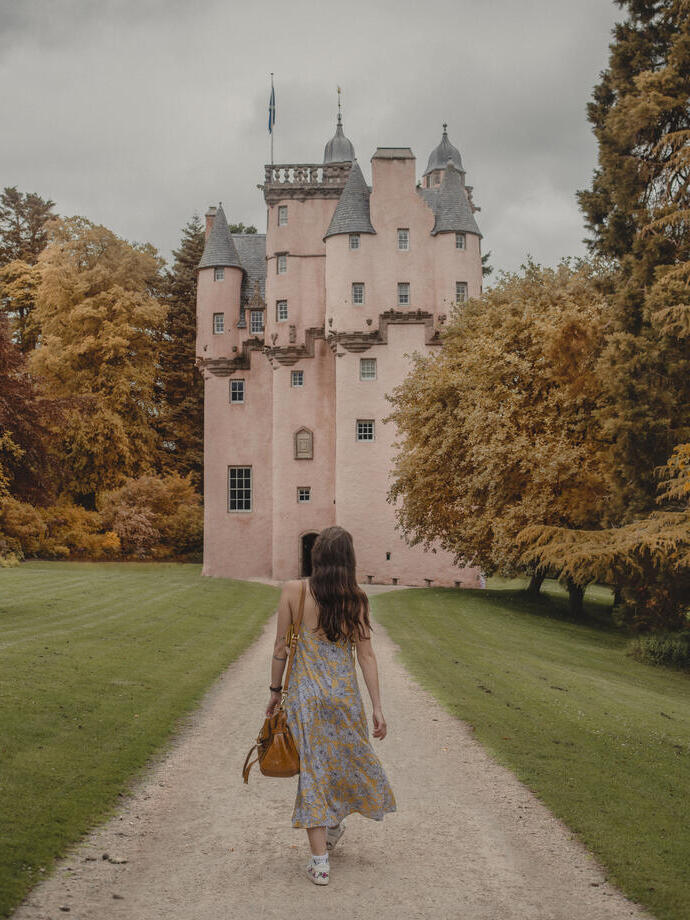 Woman walking towards a castle