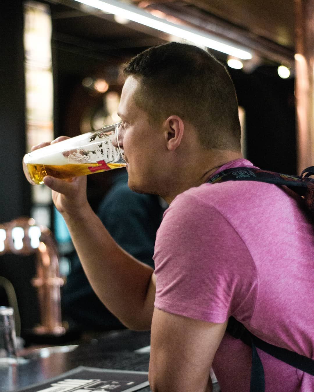 Man drinking a pint at Tennent's Wellpark Brewery
