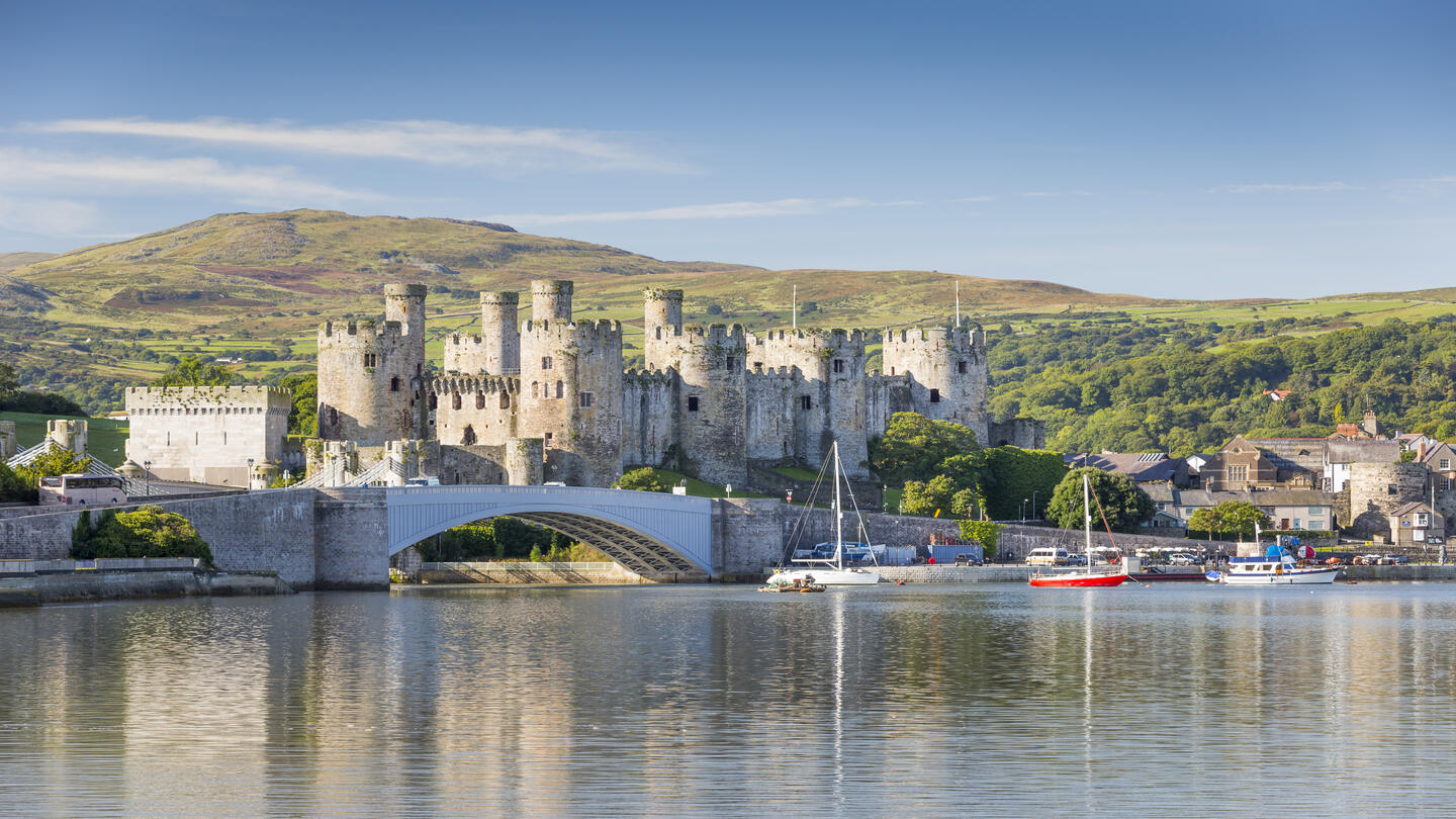Wide view of a castle from across a river