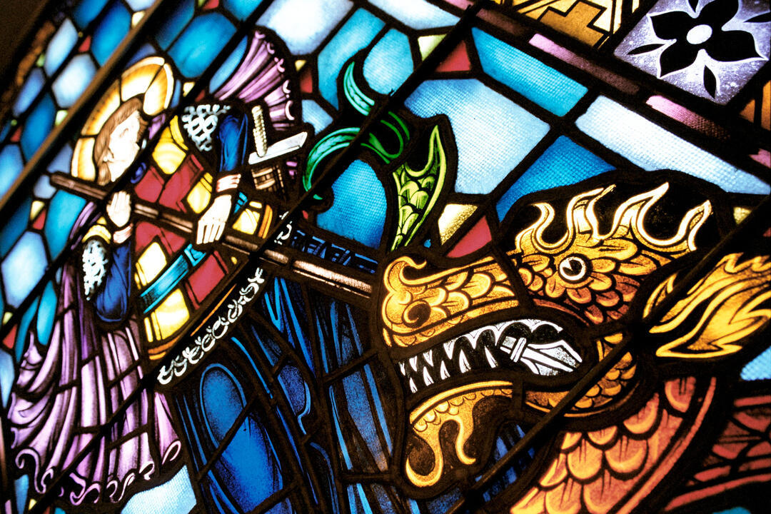 Stained glass window detail St George slaying a dragon