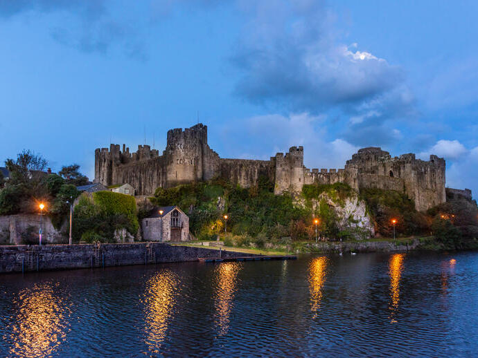A castle overlooking a river.