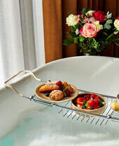 Food placed above a bath in a hotel room in Manchester's King Street Townhouse