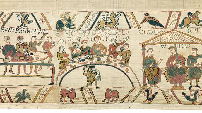 Medieval embroidered scene showing people dining, mythical creatures, and seated figures under a canopy, likely from the Bayeux Tapestry.