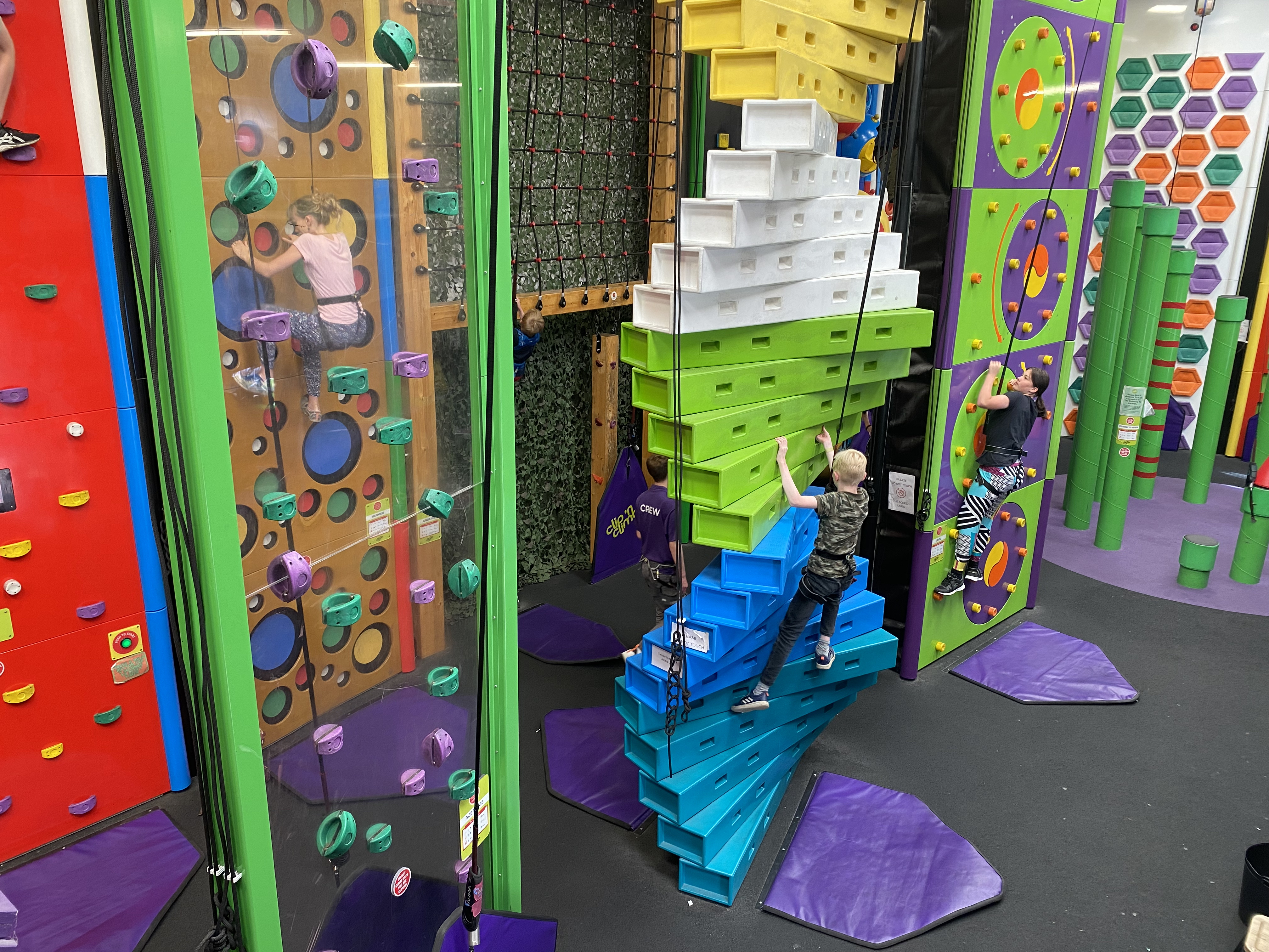 Indoor climbing facility with people training