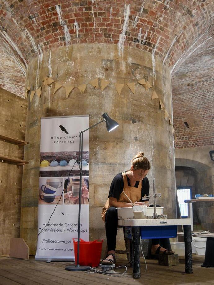 A ceramics artist at work in a studio
