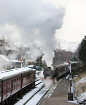 A steam train at train station