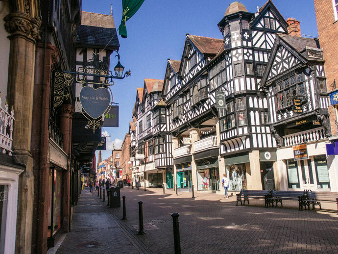 City high street with historic buildings and shops