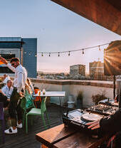 Groups of people on the roof garden at Jacobs, Cardiff
