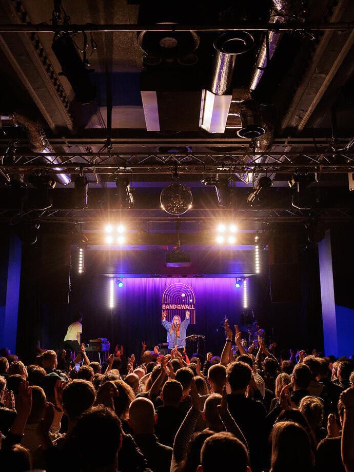 A live performance on stage at Band on the Wall in Manchester