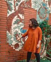 Standing infront of a mural