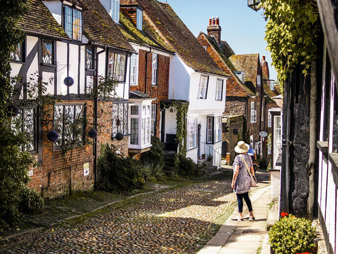 Woman looking down a narrow village street