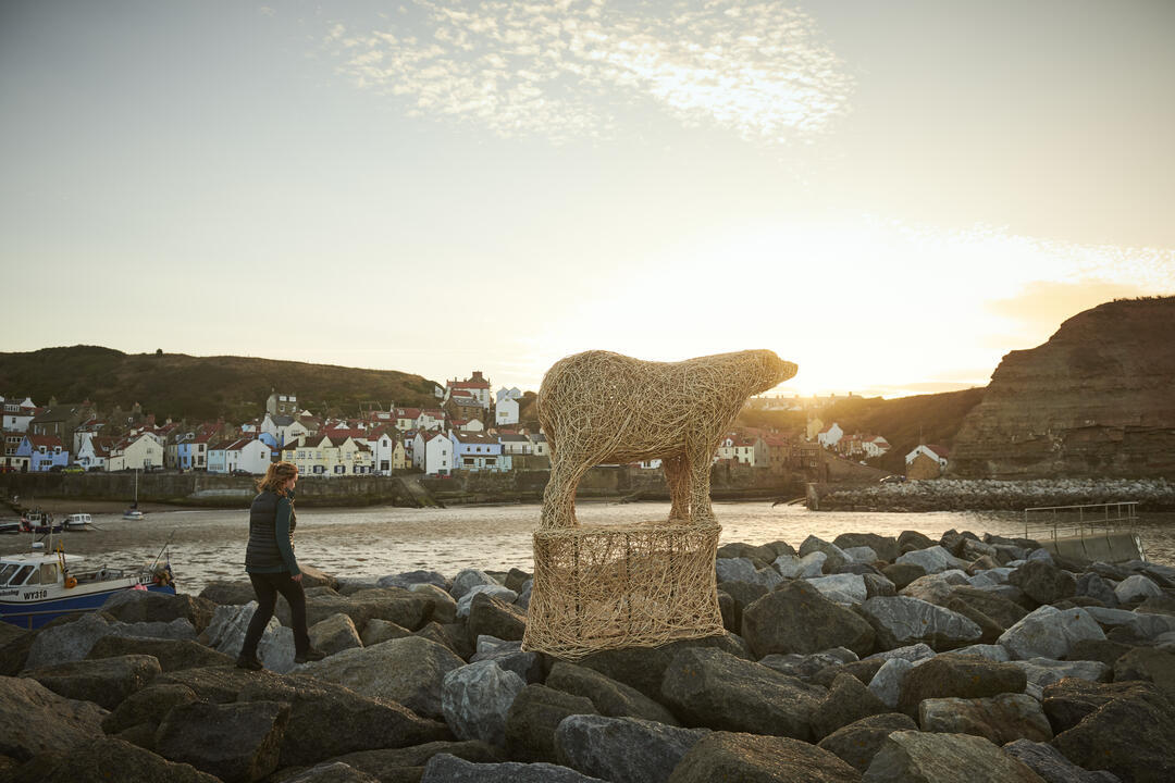 Sculpture of polar bear on an ice block made of willow
