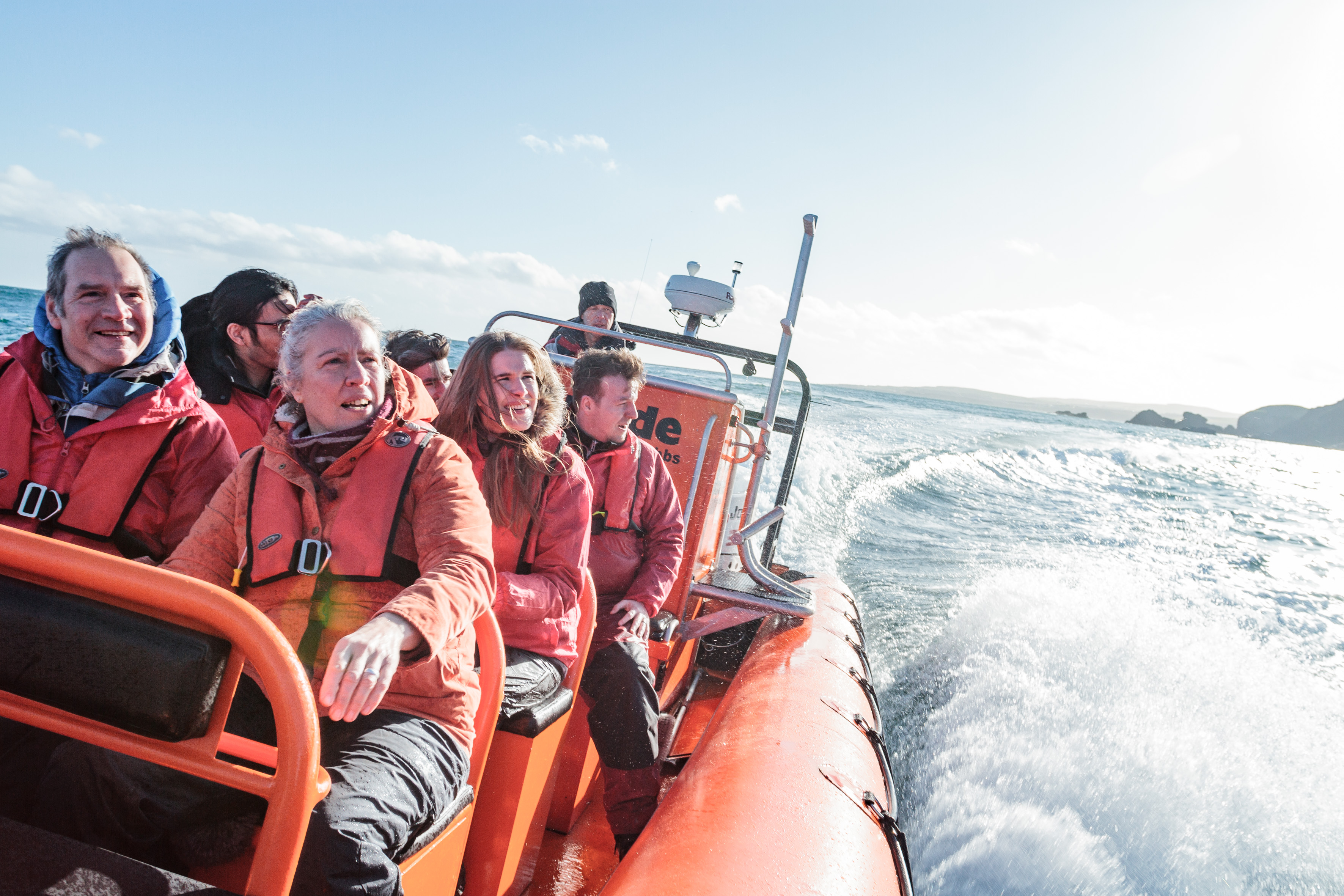 Group of people on an inflatable motorboat at sea