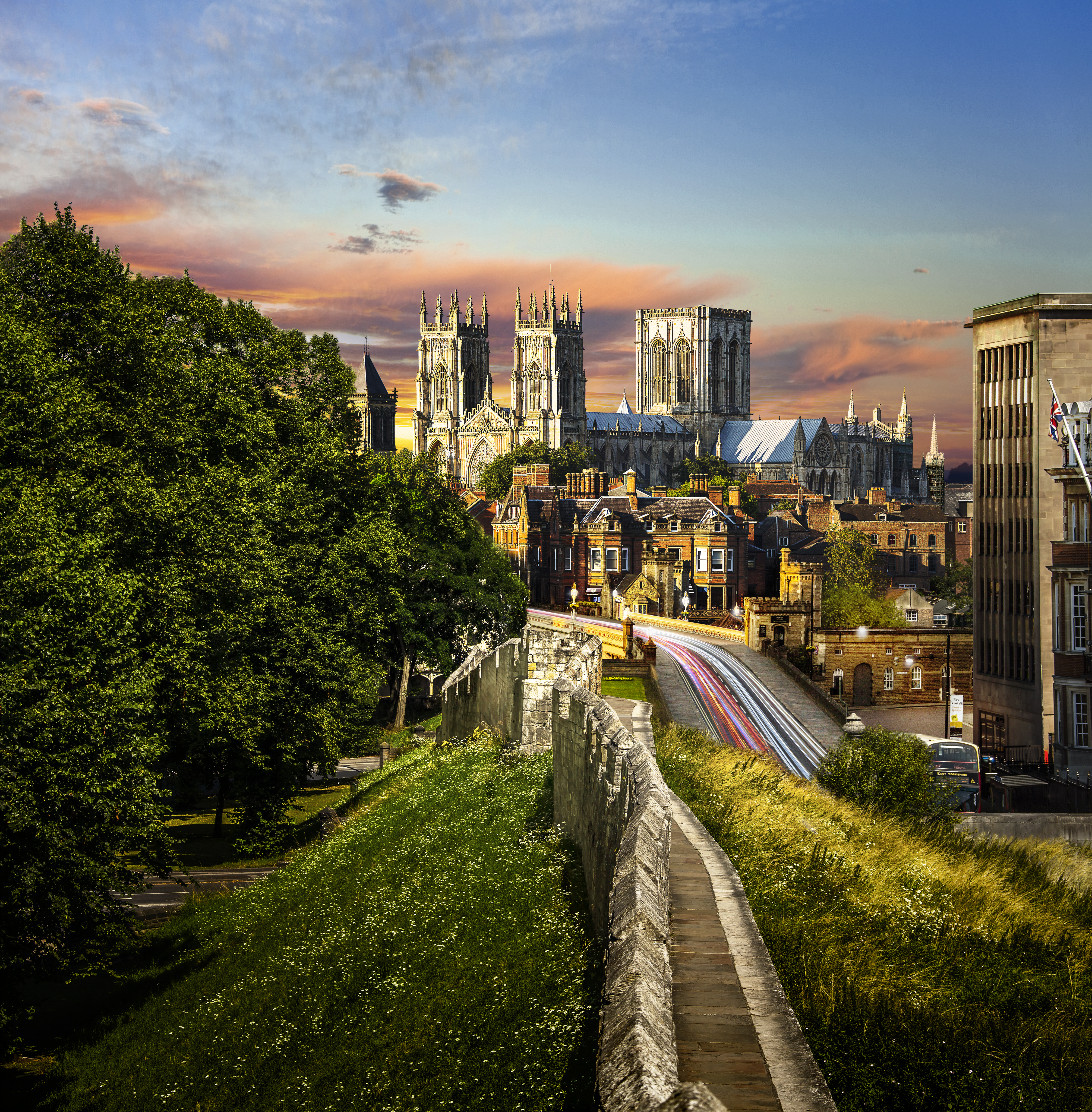 A minster in the centre of a city taken from the city stone wall