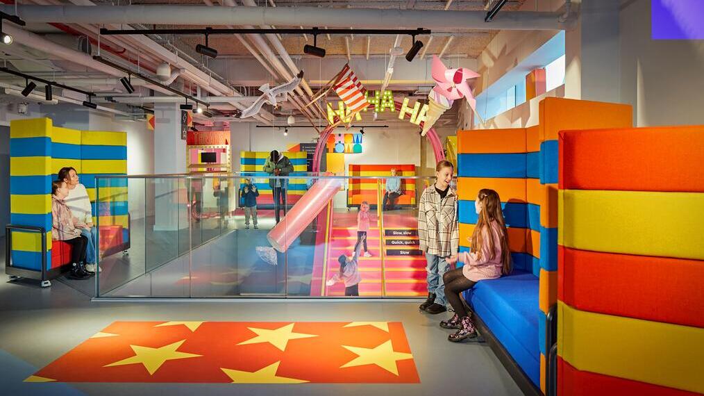 Children playing in a colourful play area