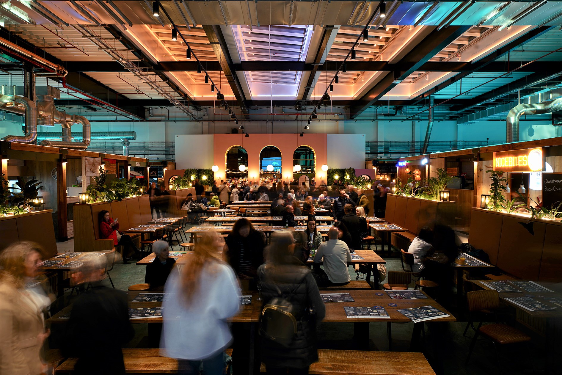 People eating food and drinking in Chester Market