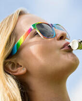 Young Woman Blowing Whistle On Gay Pride Parade