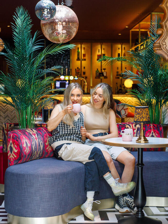 A couple enjoy coffee at The Tempus Charlton Hall