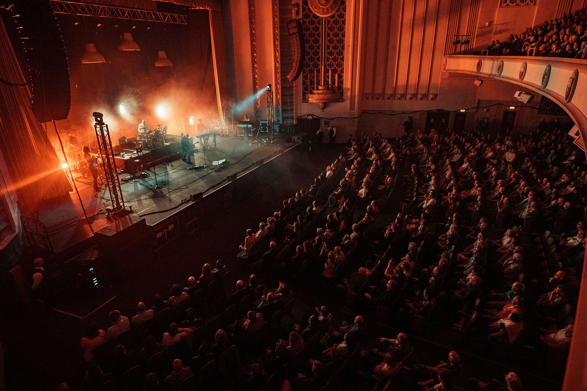 A band performing on stage at the Forum in Bath