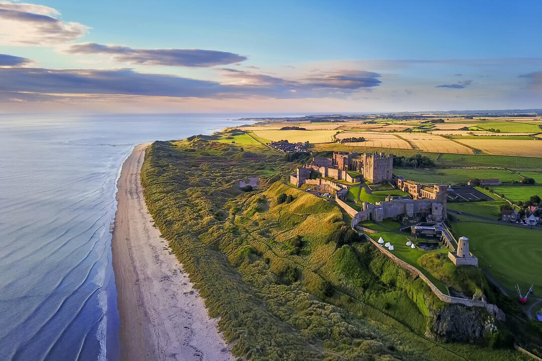 Aerial view of a large castle on the coast