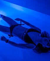 A woman in a flotation tank