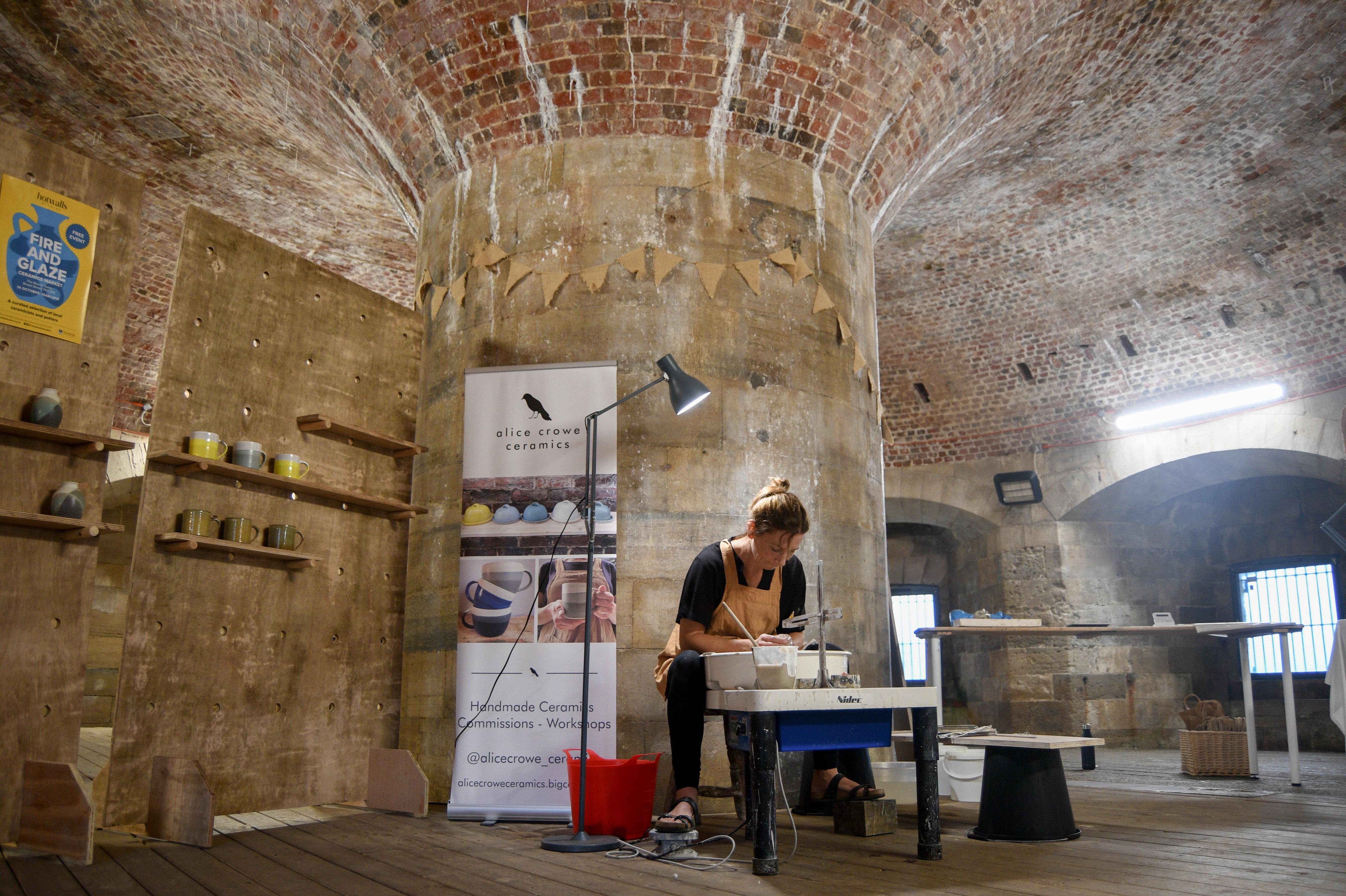 A ceramics artist at work in a studio