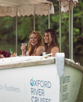 A group of people on a river boat in Oxford