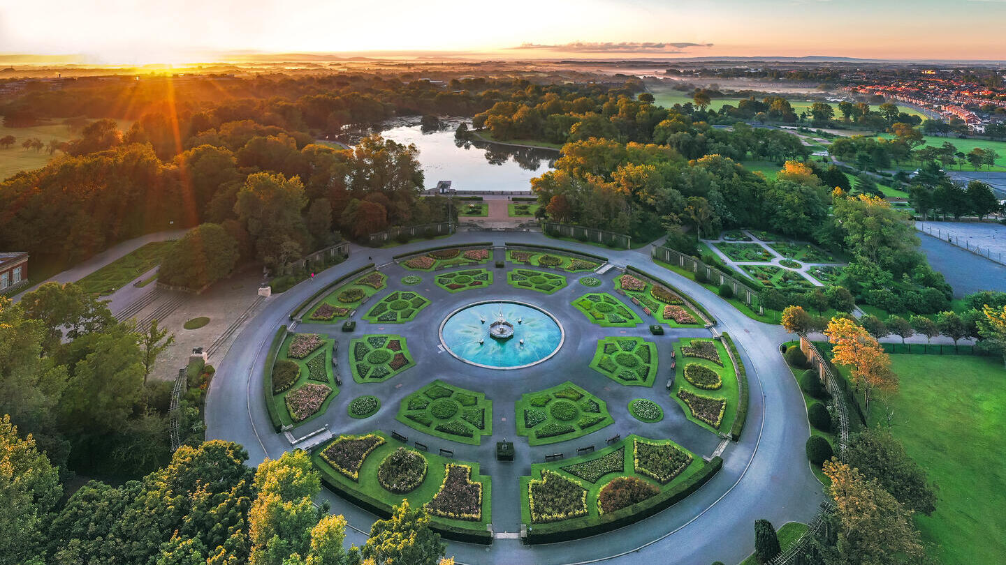Aerial shot of a park and gardens at sunset.