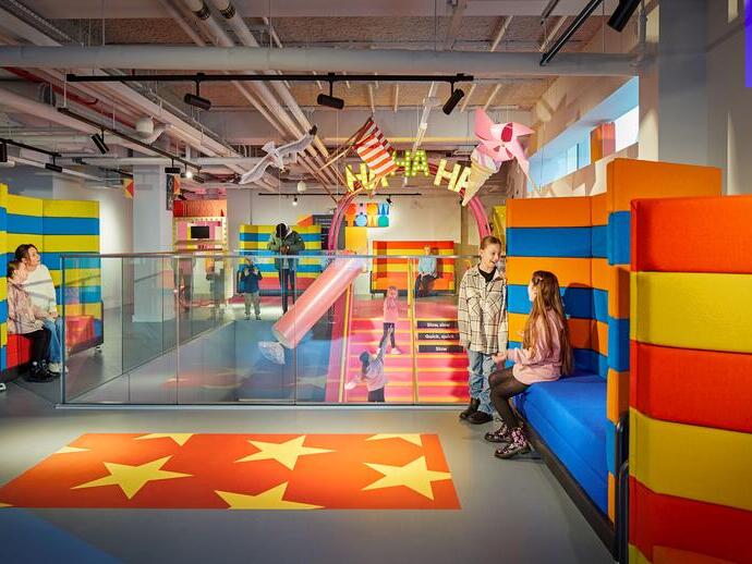 Children playing in a colourful play area