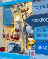A gallery window filled with cards and decorations