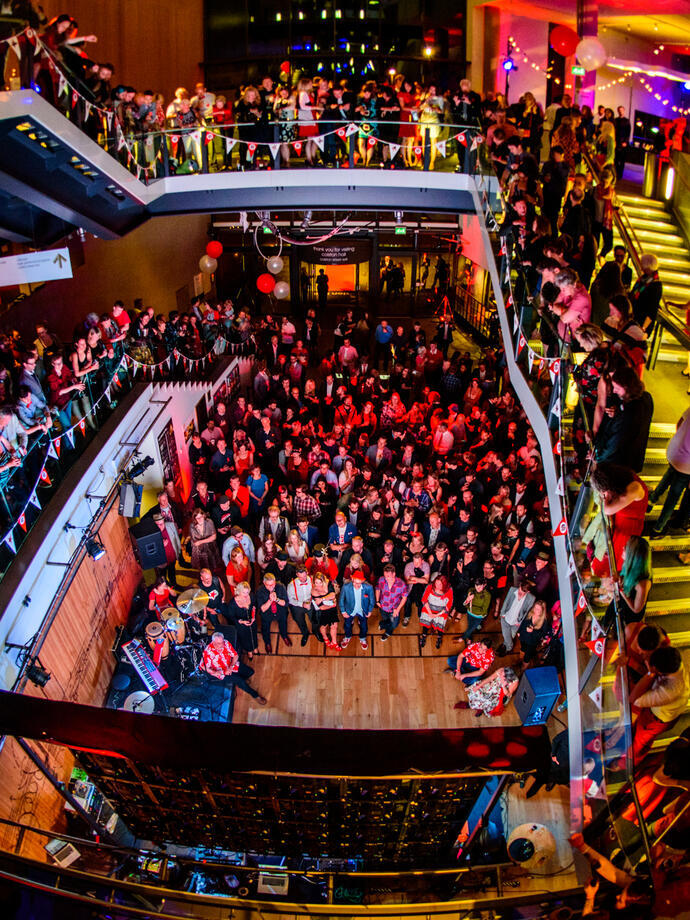 Crowds of people in a concert hall