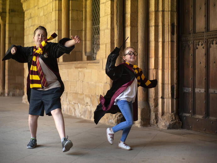 Two children dressed as Harry Potter characters at Durham Cathedral