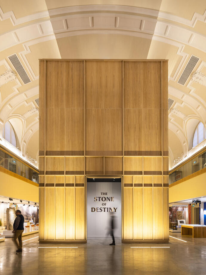 Exhibition hall of a modern museum with a sign reading 'The Stone of Destiny'.